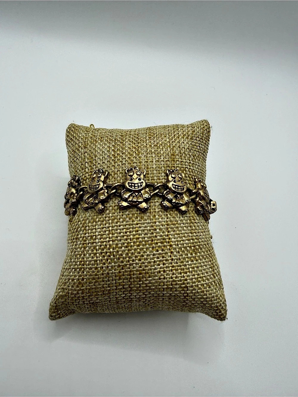 Gold tone dancing hippo charm bracelet